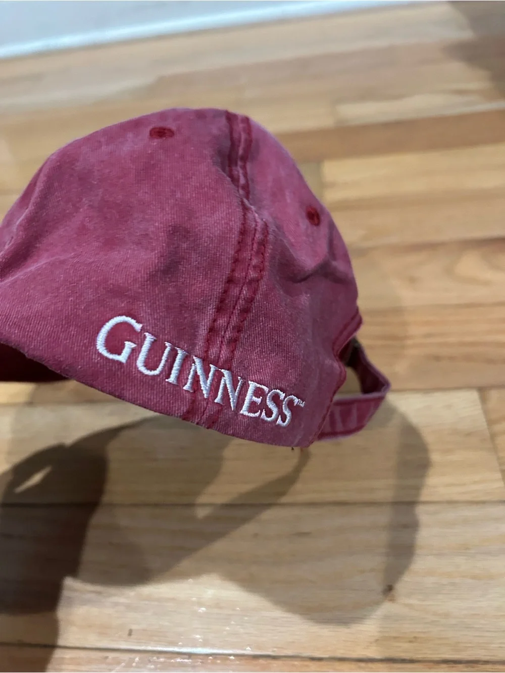 Guinness burgundy cap